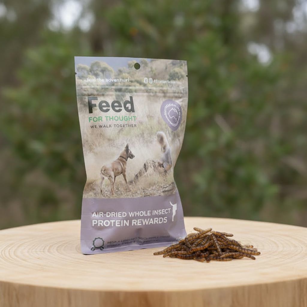 FFT Air Dried Protein Rewards on a price of timber. Image shows packaging and product with blurred trees in the background
